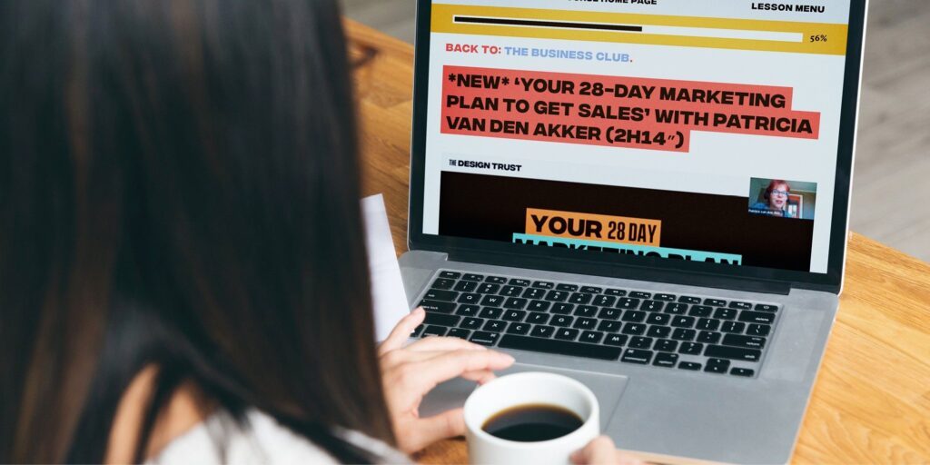 Business Club sales page lifestyle image woman on computer with marketing course on screen